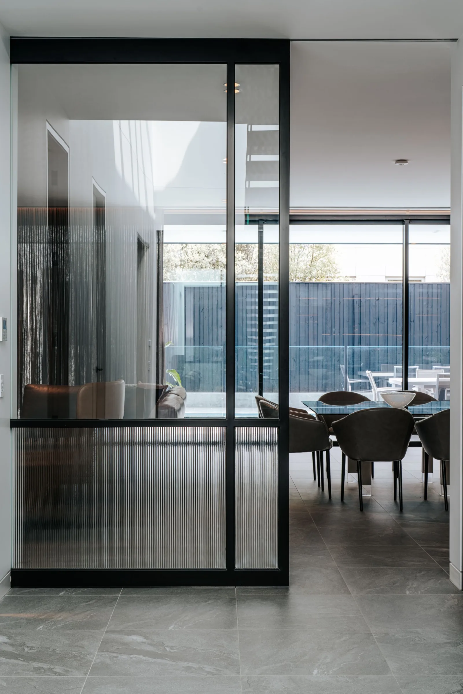 Fluted glass partition to the dining room
