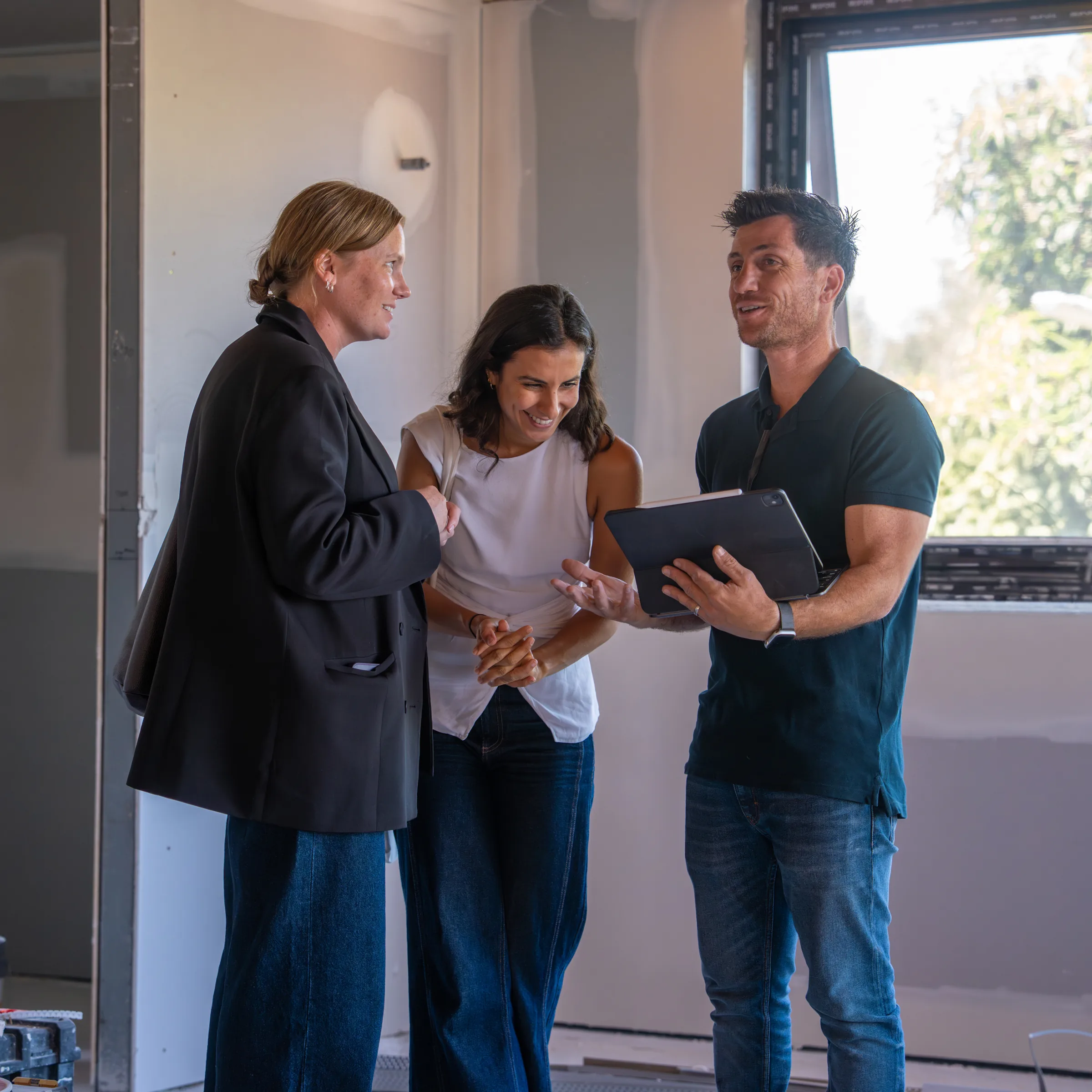 Terry and Lachlan walking a client through plans on site