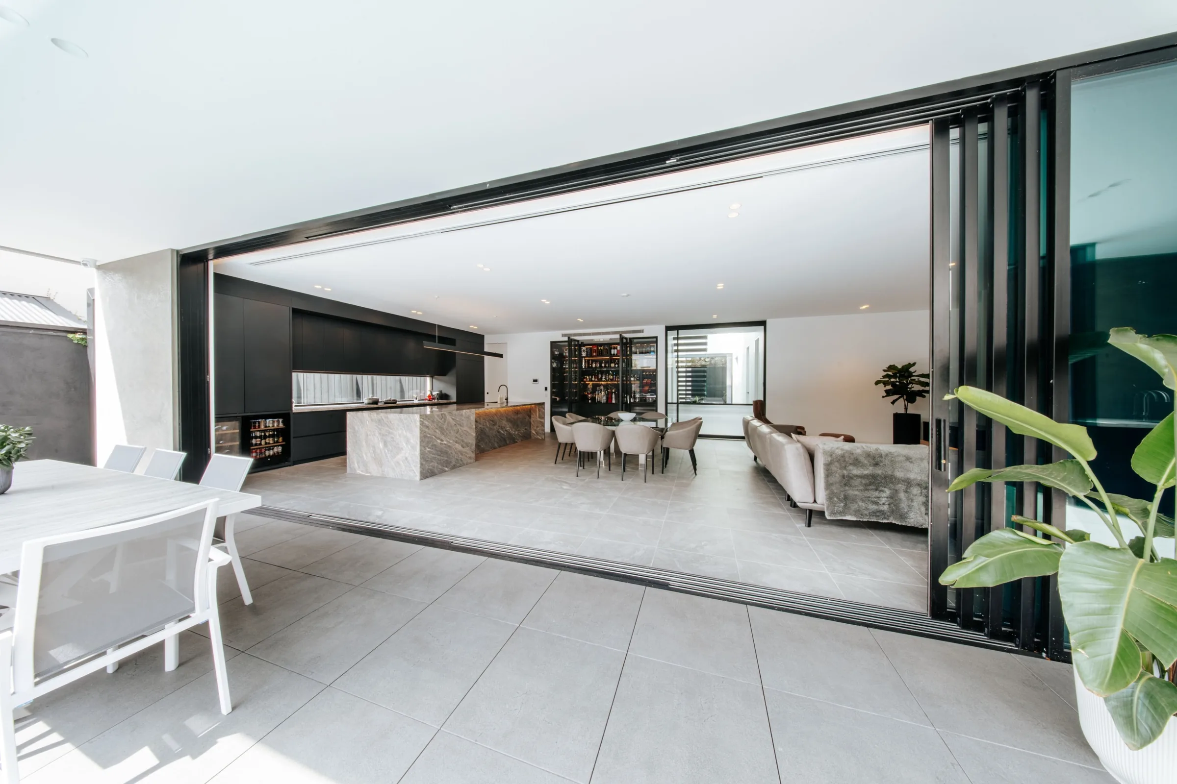 Full-width sliding doors opening the living room to the deck